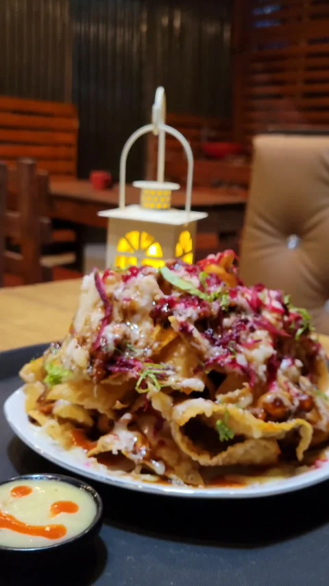 BBQ Nachos With Smiley Decorated White Sauce. Stock Footage 285621736