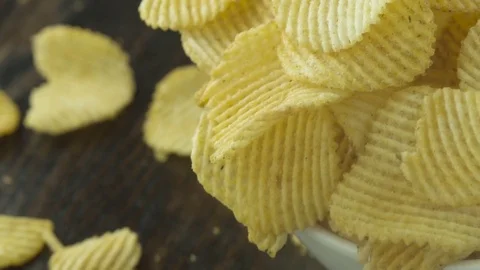 BBQ Potato Chips Overflow From White Bowl in Slow Motion Close Up 스톡 동영상 72362889