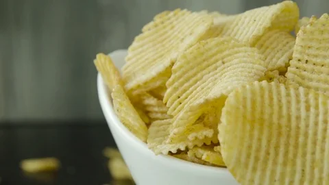 BBQ Potato Chips Overflow From White Bowl in Slow Motion 스톡 동영상 72427571
