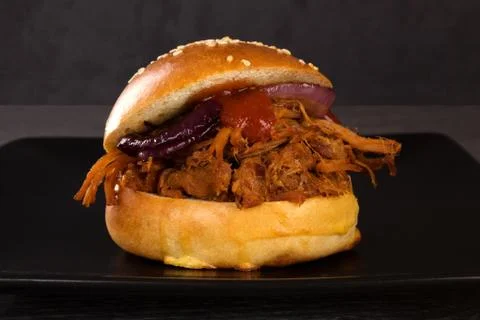 Bbq pulled pork burger on black. Stock Photos