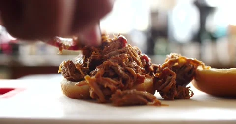 BBQ pulled pork sandwich being made hot and ready to eat on bun Video stock 207923607