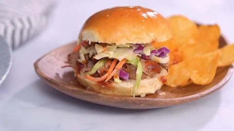 BBQ pulled pork sandwich in shape of small sliders with brioche buns. Stock Footage 107881620