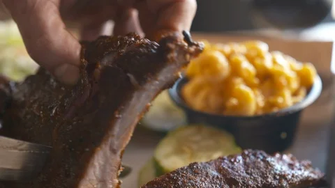 BBQ ribs being cut  Stock Footage 112575808
