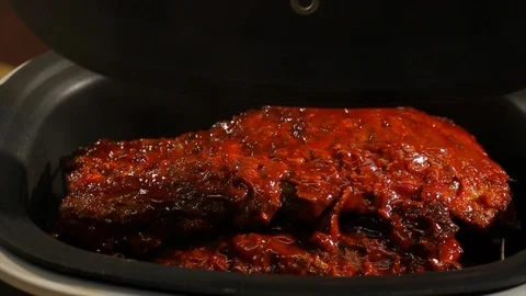 BBQ ribs steaming hot. In pressure cooker cu A Stock Footage 106827857