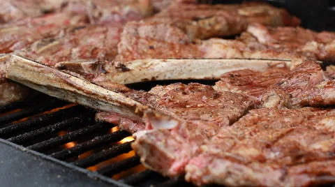 Bbq Sauce On Chicken And beef ribs On A grill outdoors ribfest T-Bone Steak Stock Footage 68197145