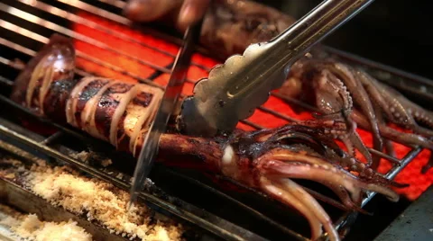 BBQ Seafood - grilled squid on night market Stock Footage 59304938