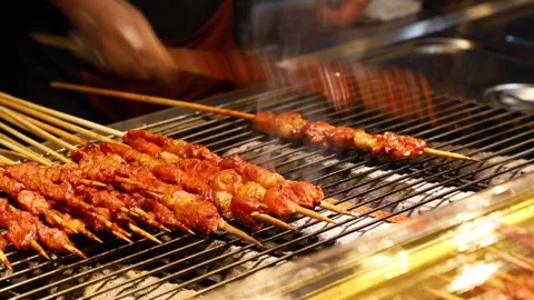 BBQ Spicy barbecue meat (lamb, chicken etc) on a stick, a traditional Chinese Stock Footage