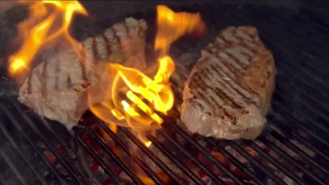 BBQ steak on grill. Grilling on fire meat Stock Footage 155671411