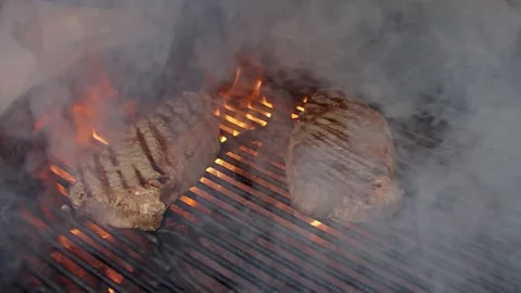 BBQ steak on grill. Grilling on fire meat. Stock Footage 155774778