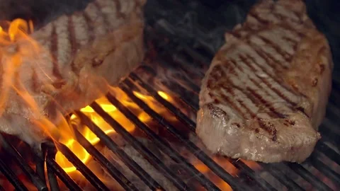 BBQ steak on grill. Grilling on fire meat. Bon appetit! Stock Footage 155774787