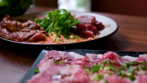 BBQ T-bone Steak Grilling over Open Fire with Flames and Smoke, 4K Slow Motion Stock Footage 326464243