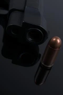 Bbullet and gun on black Stock Photos