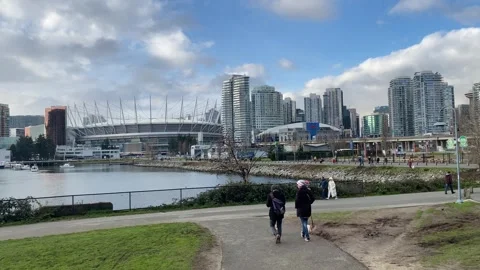 BC Place Stadium skyline from False Creek Park Seawall Stock Footage 282326595