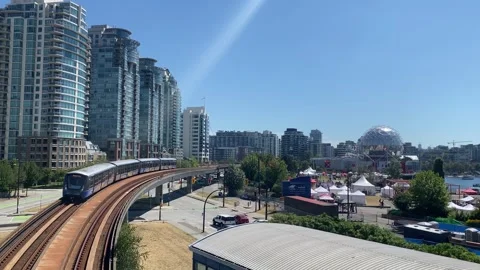 BC Transit Skytrain at Science World on Sunny Day Stock Footage 281058371