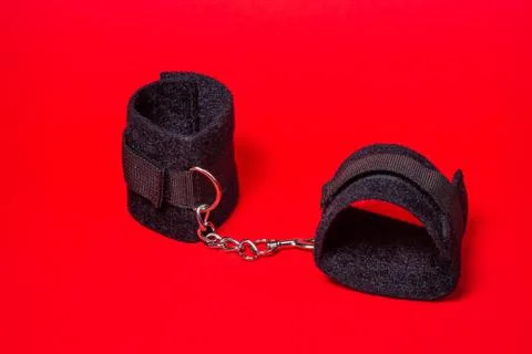 BDSM accessories on a red background.  Stock Photos