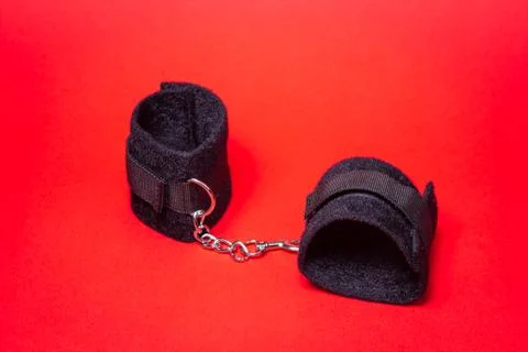 BDSM accessories on a red background.  Stock Photos