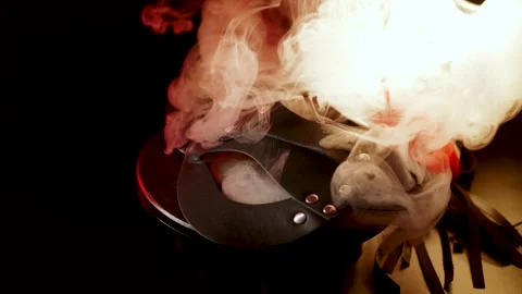 BDSM cat mask rotates on black background Stock Footage 305302061