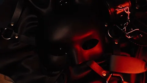BDSM set of erotic toys from a sex shop. Mask, leather belt, handcuffs and whip Stock Footage