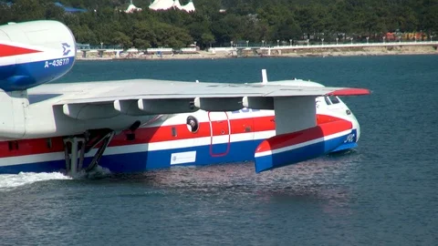 Be-200ES aircraft floats through water on background of Gelendzhik Bay. Stock Footage 125610094