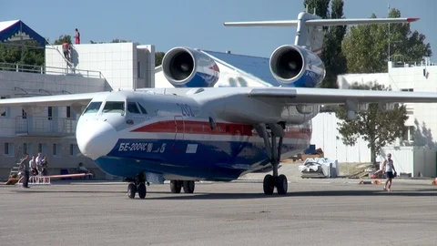Be-200ES aircraft makes U-turn on concrete platform in direction of sea. Stock Footage 123210032