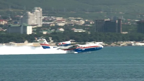 Be-200ES amphibious aircraft accelerates through water and takes off. Stock Footage 121533089