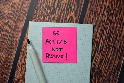 Be Active Not Passive! write on sticky notes isolated on office desk. Stock Photos