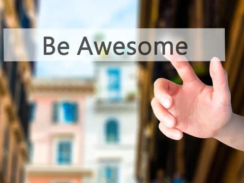 Be Awesome - Hand pressing a button on blurred background concept on visual s Stock-Fotos