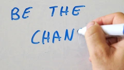 Be The Change Solgan On Whiteboard Stock Footage 117587037