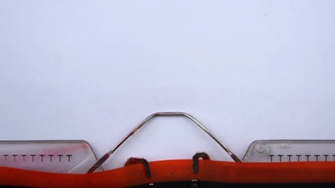 To be continued - phrase printed on an old typewriter in red letters, close up. Stock Footage 126777334