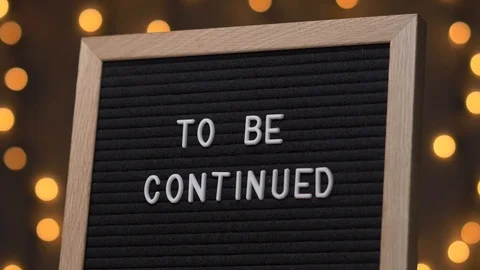 TO BE CONTINUED Words on a Black Letter Board Message Sign Video stock 93699744