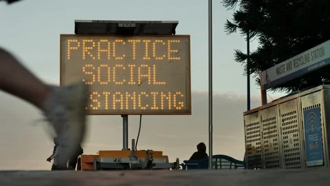 Be Covid Safe sign at Coogee beach Sydney slow motion 4K Stock Footage 197404239