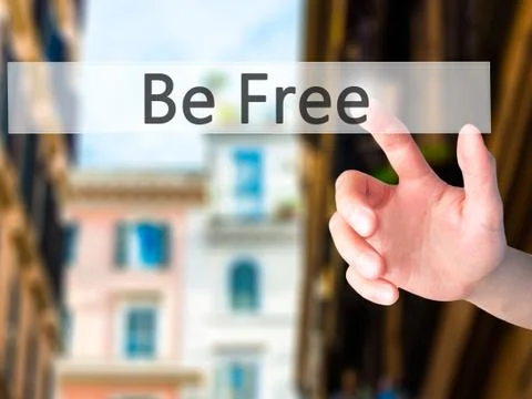 Be Free - Hand pressing a button on blurred background concept on visual scre Stock Photos