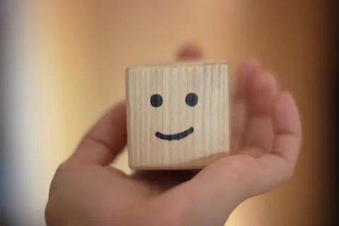 Be happy or smile on wooden cube Stock Photos