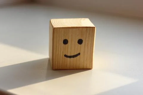 Be happy or smile on wooden cube Stock Photos
