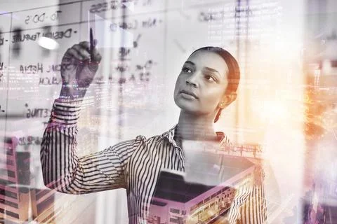 Be innovative my thinking differently. a young businesswoman using a digital Stock Photos