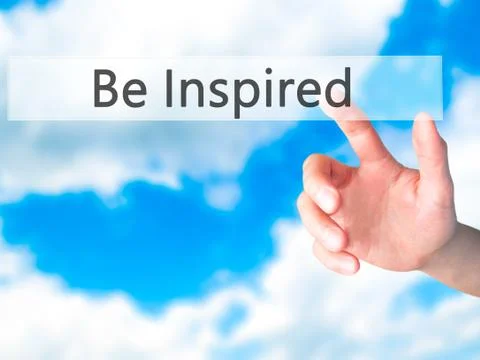 Be Inspired - Hand pressing a button on blurred background concept on visual  Stock-Fotos