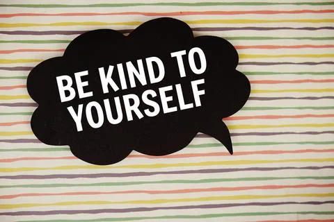Be Kind To Yourself text with speech bubble top view on colorful stripes ba.. Stock Photos
