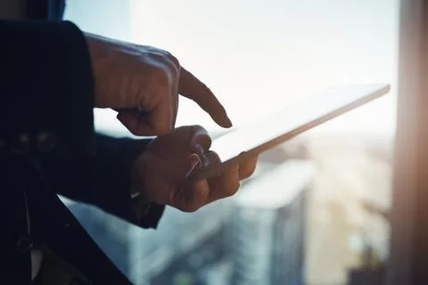 Be in the know whenever you need. Closeup shot of an unrecognizable businessman Stock Photos