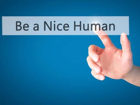 Be a Nice Human - Hand pressing a button on blurred background concept on vis Stock-Fotos