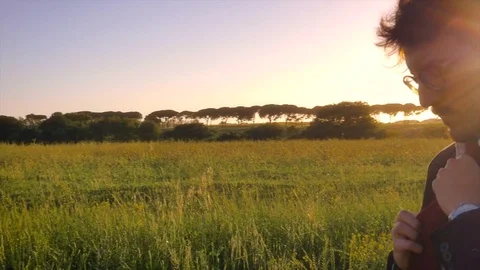 Be ready. Young businessman in the middle of the nature Stock Footage