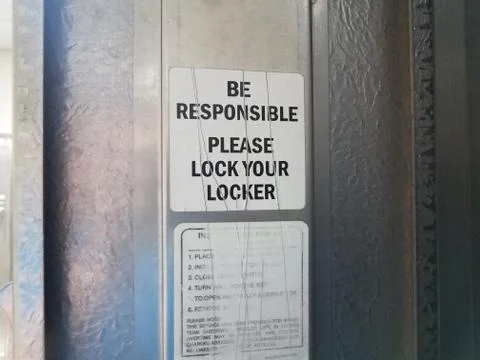 Be responsible please lock your locker sign Stock Photos