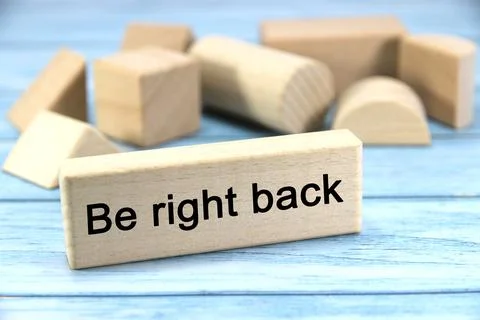 "Be right back" text or message short word english letter on wooden cubes b.. Stock Photos