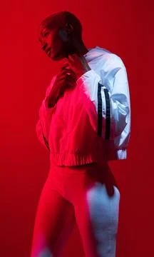 Be savage, not average. Red filtered shot of a sporty young posing in the studio Stock Photos