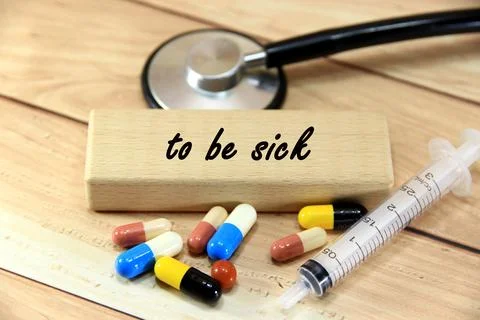 "to be sick" text or message short word english letter with capsule pills o.. Stock Photos
