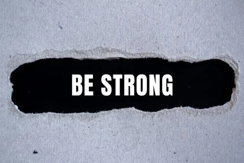 Be Strong message written on ripped torn paper background. Conceptual Be St.. Stock Photos