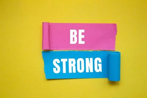 Be Strong message written on ripped torn paper background. Conceptual Be St.. Stock Photos