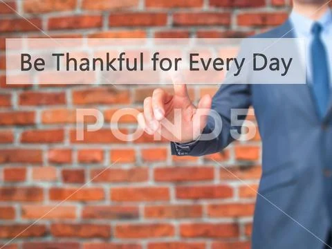 Be Thankful for Every Day - Businessman hand pressing button on Stock Photos