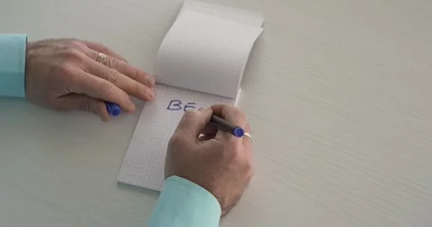Be with us  - this word is written on the sheet by a man's hand Stock Footage 267082974