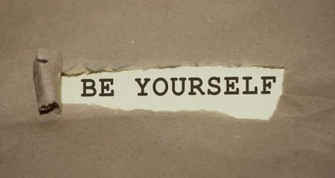 Be yourself phrase written under torn paper. Personal brand rebranding concep Photos