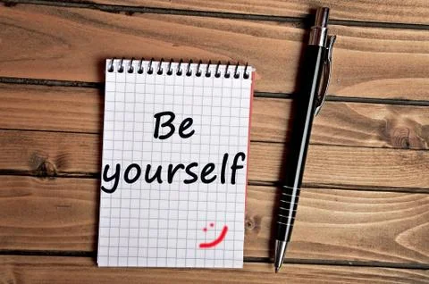Be yourself words on notebook Stock Photos